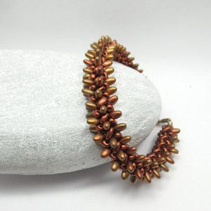 Spiky Copper tone herringbone woven bracelet